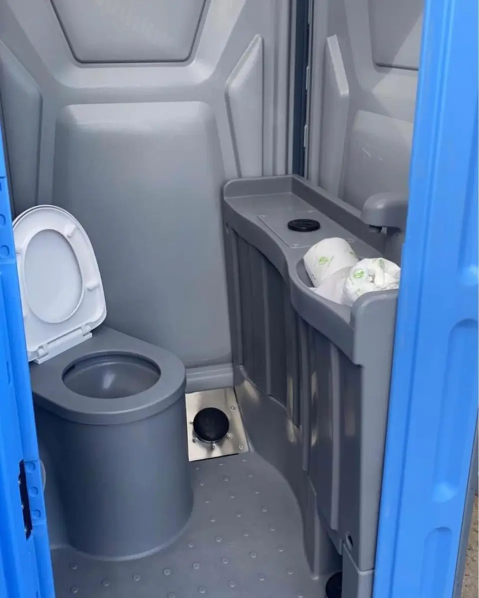 Hand sanitizer and shelf inside a serviced unit