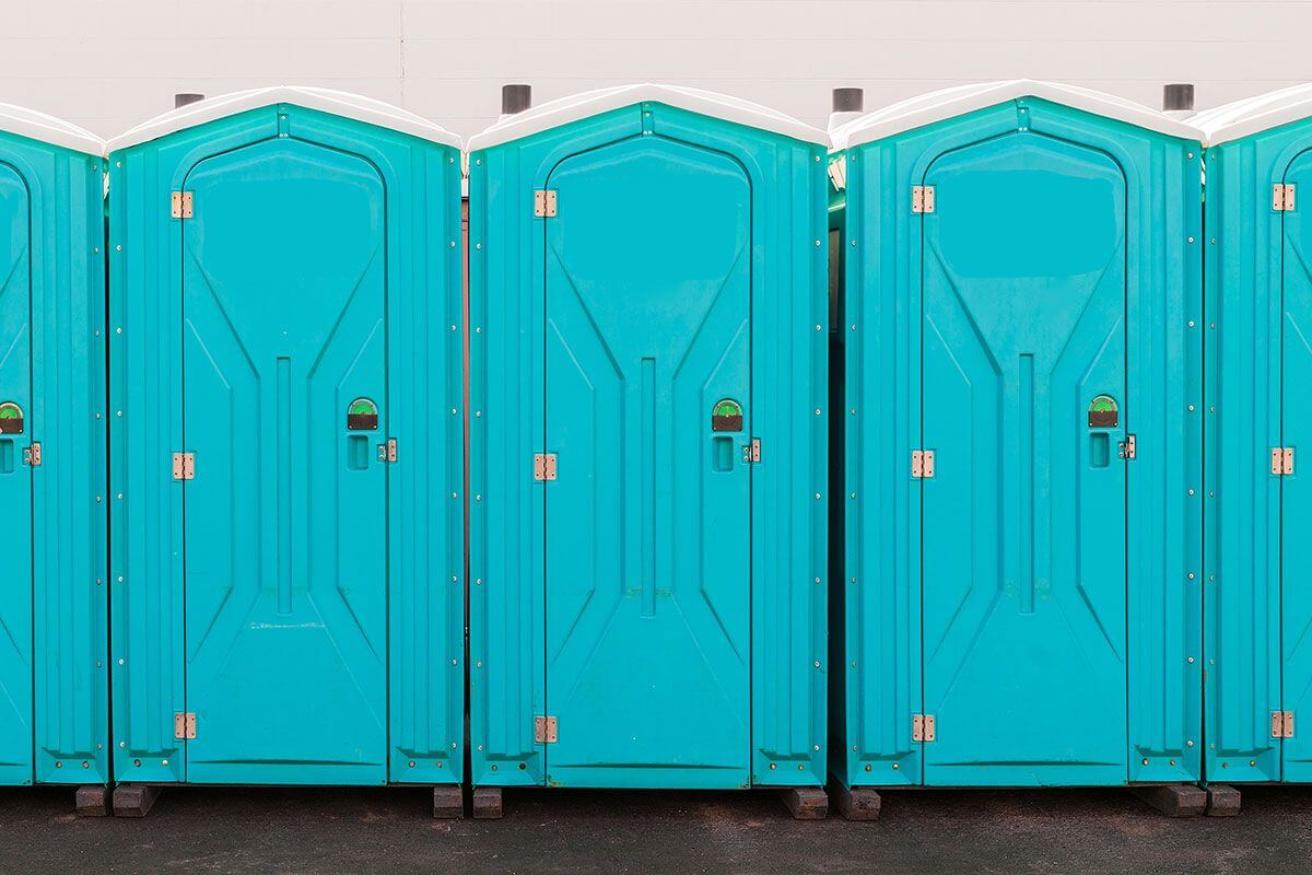Industrial portable restroom units at a plant in Plano, Texas